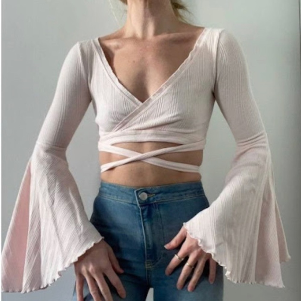 Small free people light pink blouse/crop top with bell sleeves and wrap tie